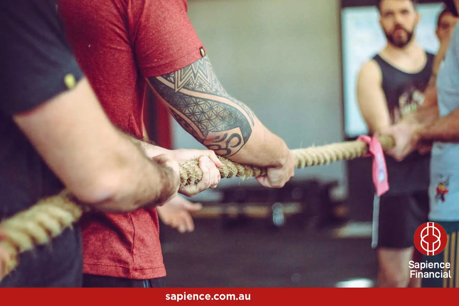 siblings preparing for a tug-of-war with a thick rope