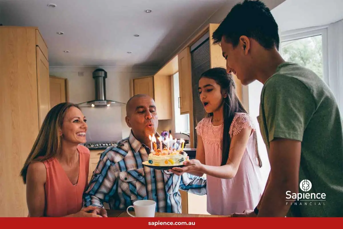 family birthday with cake and candles