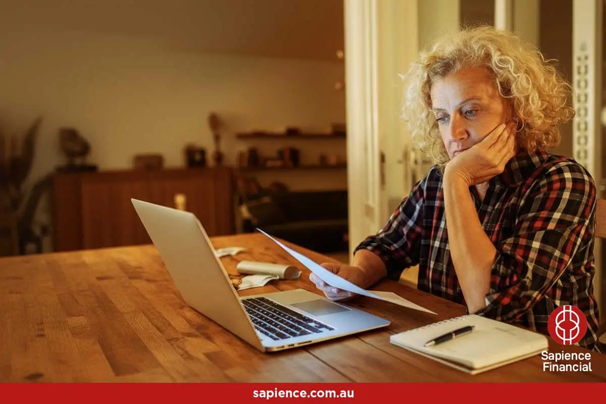 a middle aged women looking at the rental statement