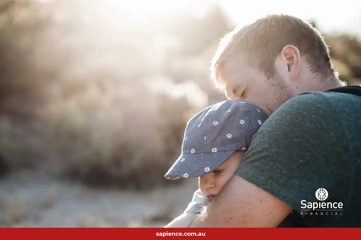 father hugging young child